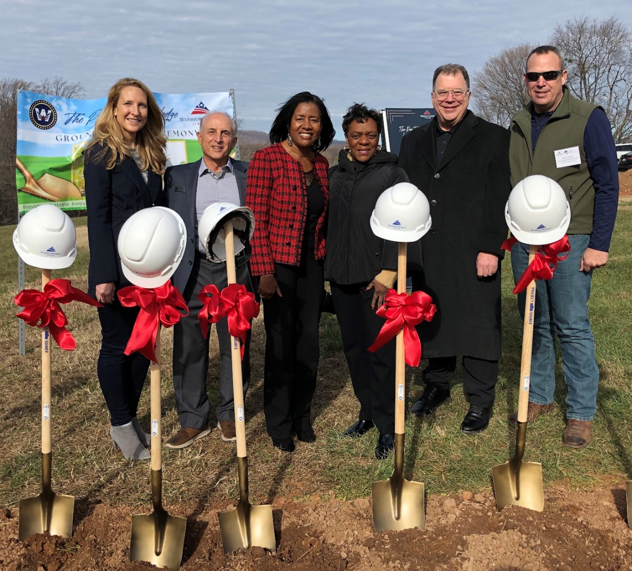 Photo with Willing Warriors leadership and University of Phoenix alumni at the ground-breaking ceremony December 2, 2022, left to right: Sarah Ford, executive director, Willing Warriors; John Dominick, co-founder, Willing Warriors; Shirley Dominick, president and co-founder, Willing Warriors (alum); Barbara Smith, vice president, University of Phoenix District - Maryland - Virginia Alumni Chapter (alum); Kent Blumberg, faculty and national account manager, University of Phoenix (alum); and Ken Lukonis, Board member, Willing Warriors (alum).