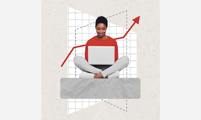 Woman sitting cross-legged with an open laptop on her lap.
