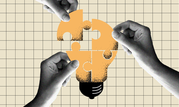 Three hands holding puzzle pieces to form a yellow lightbulb.