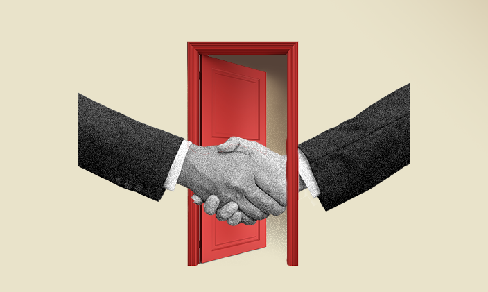 Two hands extended in a handshake with a red open door in the background.