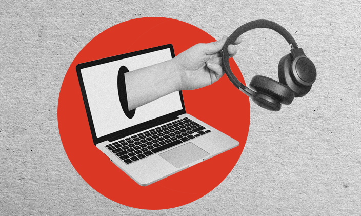An open laptop with a hand extending from the screen, holding a pair of headphones.