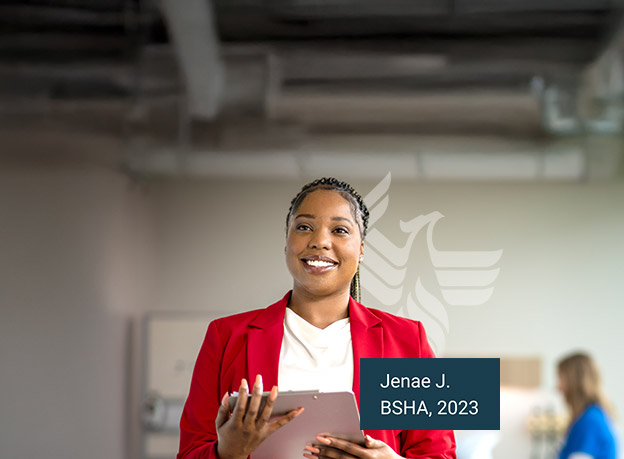 A woman in a red blazer smiles, celebrating the career-ready skills she gained from her online healthcare administration degree.