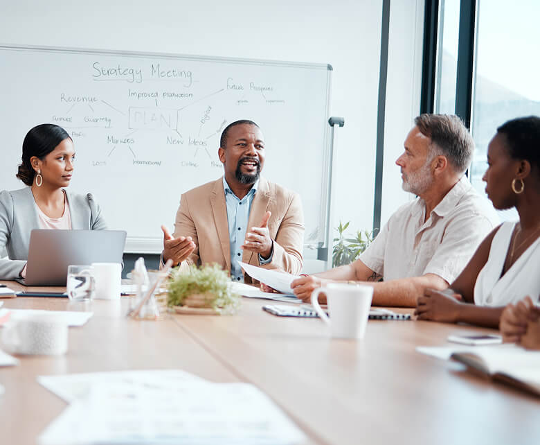 Group of professionals talking around a table